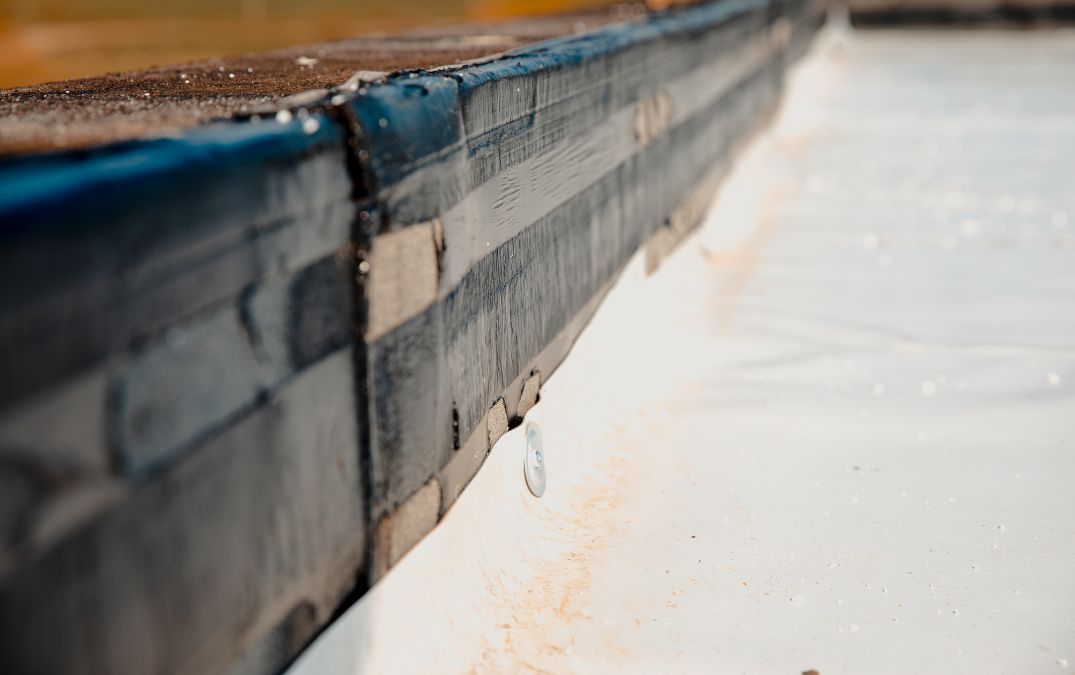 A vapor barrier installed on concrete slab to prevent hardwood floor from warping.