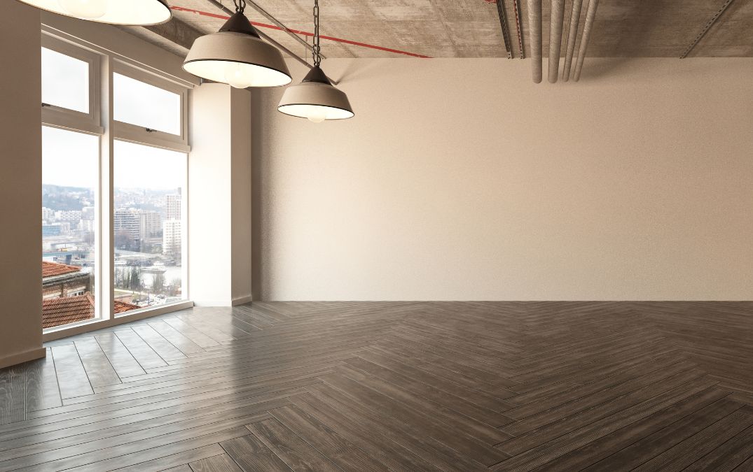 Dark herringbone wooden plank design in a room.