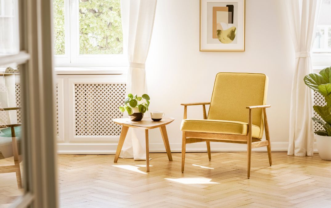 Tan coloured herringbone floor in living room.